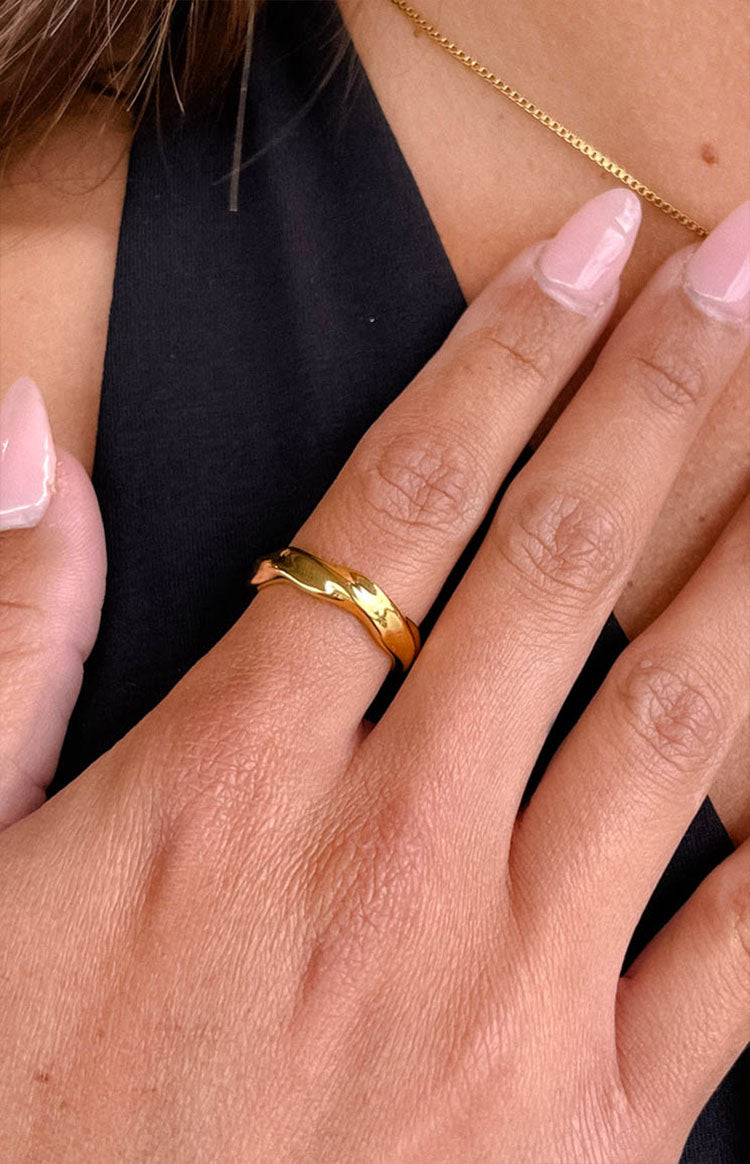 Beginning Boutique Edern Gold Wave Ring gold wave ring with a smooth, polished, undulating band