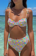 Front view of a pastel painted floral bikini top with underwire cups and tie-shoulder straps, paired with matching high-waisted bikini bottoms