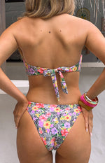 Back view of the white zebra floral bikini top with a bow tie closure