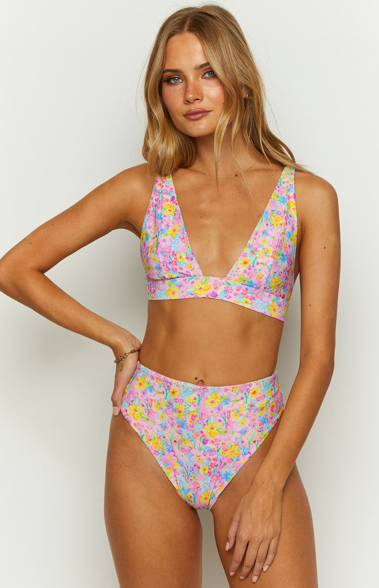 Front view of a pink painted floral bikini top with a deep V-neckline, wide shoulder straps, and a supportive underband
