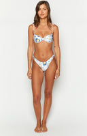 Rear-side view of white bikini bottoms with blue and yellow Italia print and a high-cut cheeky fit