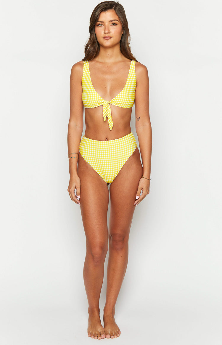 Yellow gingham high-waisted bikini bottoms featuring a high-cut leg and snug fit