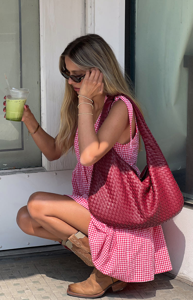 Red gingham mini dress with a full, gathered A-line skirt