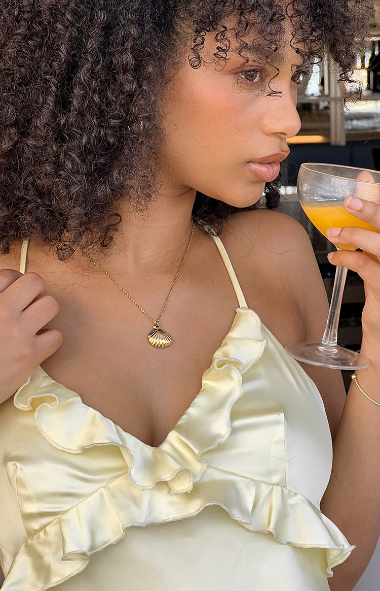 Beginning Boutique Ariel Gold Shell Necklace gold delicate chain necklace with a ridged shell pendant