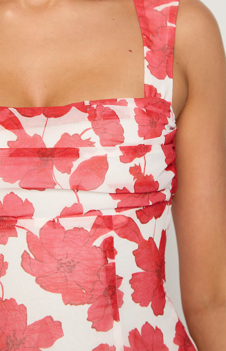 Close-up of the ruched bodice with a square neckline and shoulder strap on the red anemone floral print dress