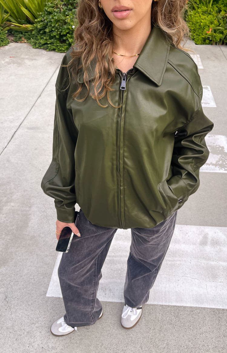 Olive PU bomber jacket with a wide pointed collar, silver front zipper, and elasticated cuffs