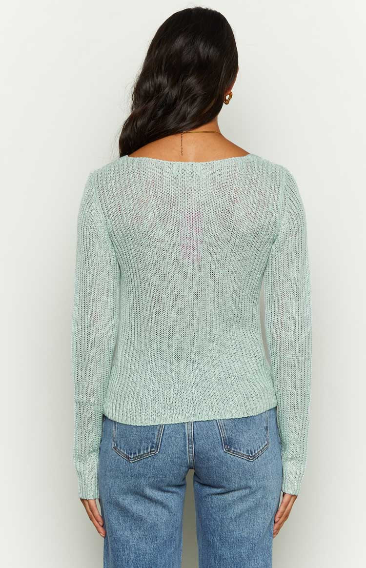 Rear view of a light blue long sleeve knit top with a wide square back neckline and sheer ribbed texture