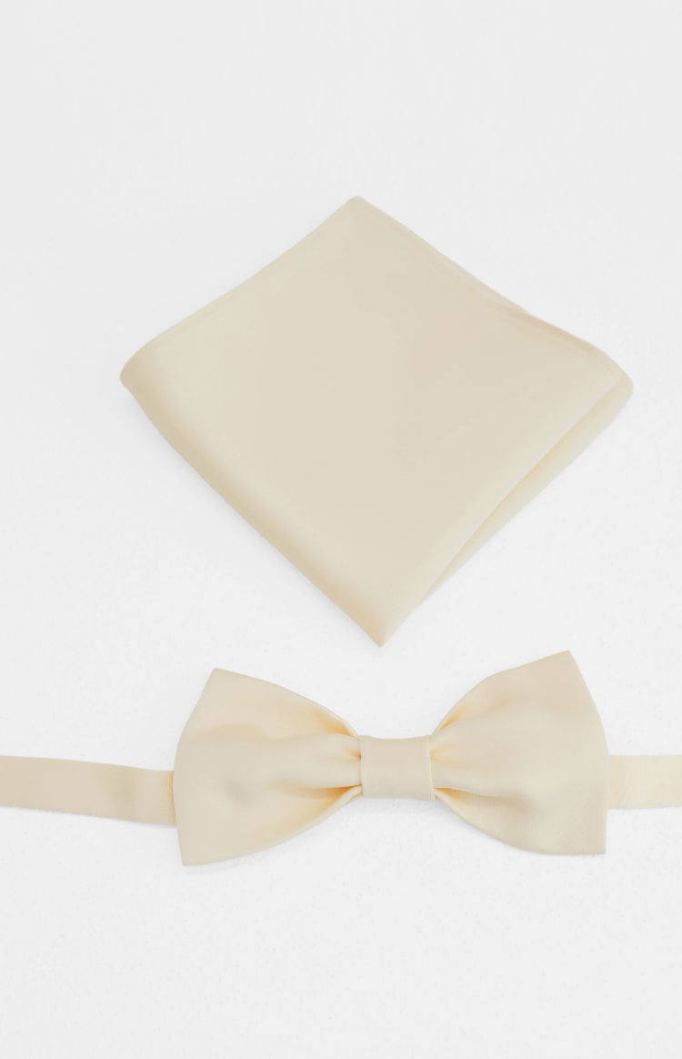 Cream yellow bow tie with a flat strap and a neatly folded matching pocket square