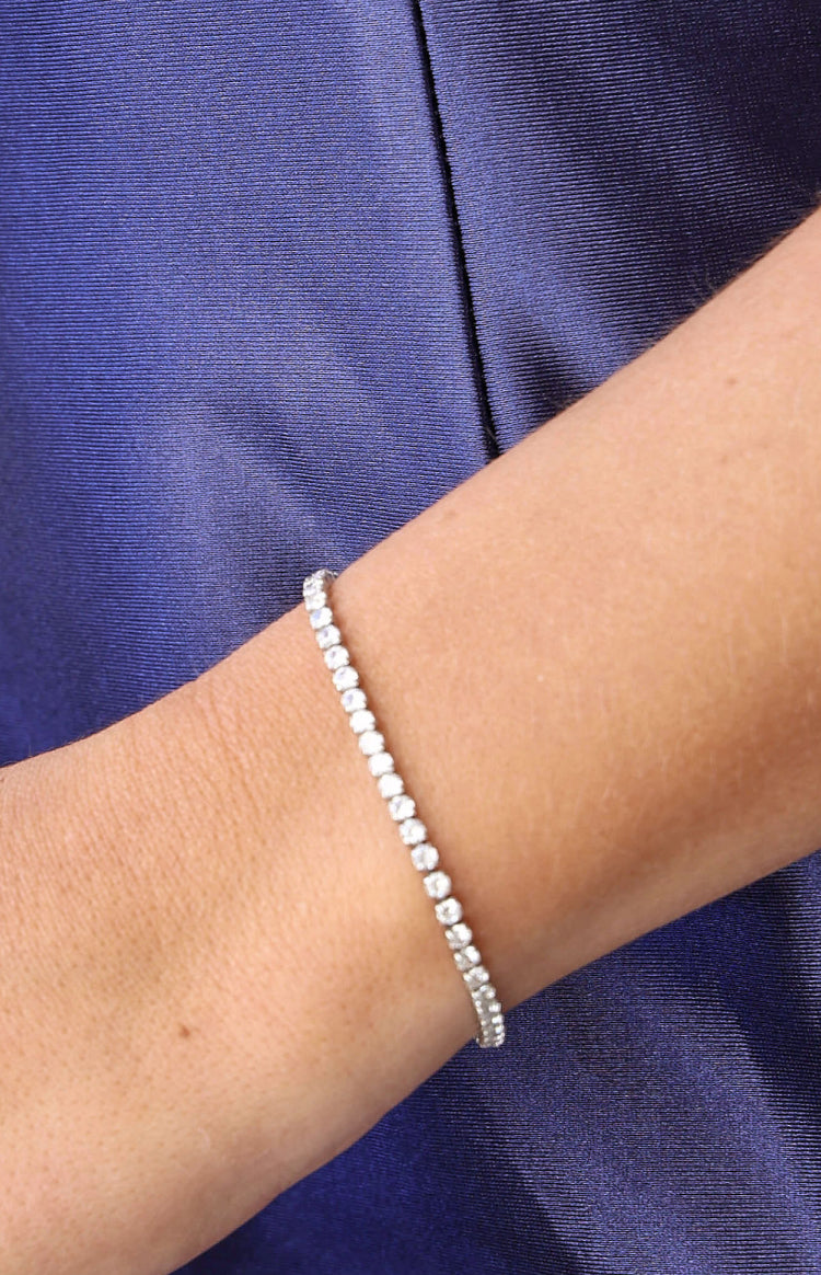 Close-up of a silver diamante tennis bracelet with a continuous line of sparkling stones