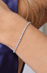 Close-up of the silver tennis bracelet highlighting the sparkle of each round diamante