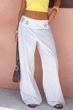 Beginning Boutique Alamara White Floral Detail Wide Leg Pants white wide leg pants with floral cutouts on the waistband