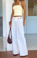 Beginning Boutique Alamara White Floral Detail Wide Leg Pants white wide leg pants with floral cutout details on the waistban