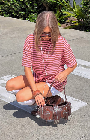 Pink and brown striped oversized tee with a round neck, short sleeves, and a relaxed fit