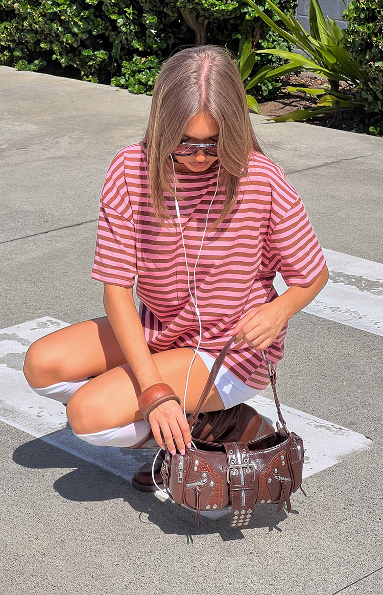 Pink and brown striped oversized tee with a round neck, short sleeves, and a relaxed fit