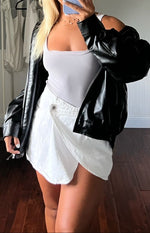 Beginning Boutique Alcmene White Denim Asymmetrical Wrap Mini Skirt white denim asymmetrical wrap mini skirt with a single bu