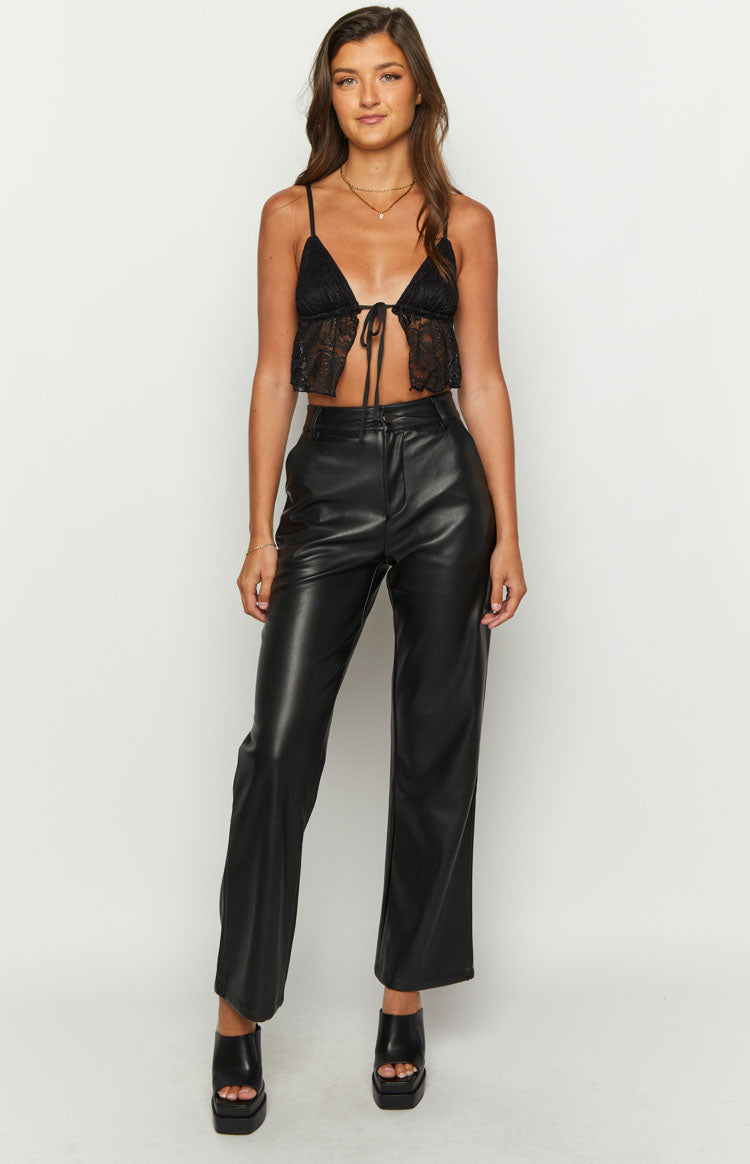 Front view of the black lace tie-up crop top with delicate spaghetti straps