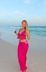 Fuschia lace maxi skirt with side tie-up waist cutouts and a fitted silhouette