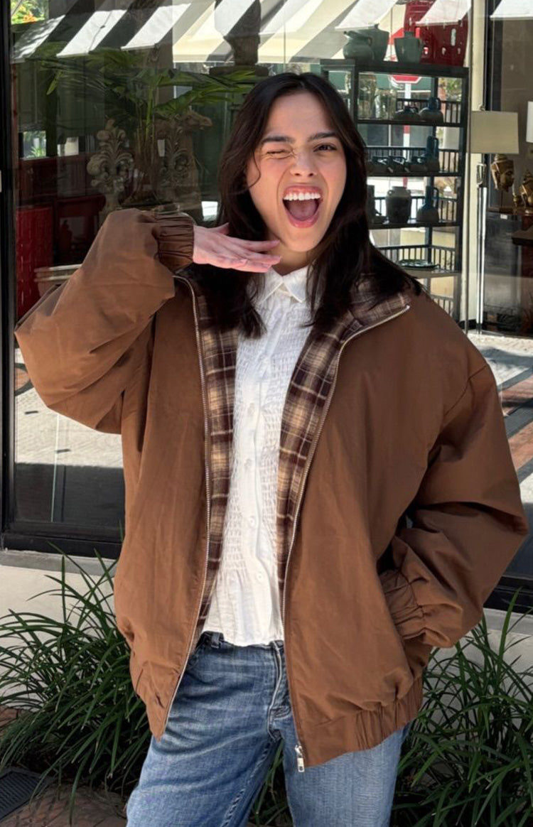 Beginning Boutique All I Wanted Brown Plaid Puffer Jacket brown puffer jacket with a brown plaid lining, zipper front, and elasticated cuffs and hem