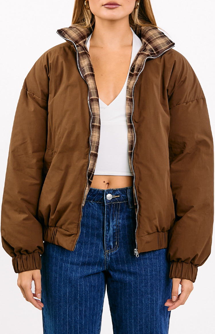 Open brown puffer jacket revealing a brown plaid lining on the collar and front zipper, with ribbed cuffs and hem