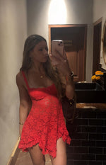 Red floral lace mini dress with thin straps, a sweetheart neckline, and a ruffled asymmetrical hem
