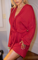 Embroidered BB logo on the chest pocket of a burgundy V-neck robe with cinched tie-waist