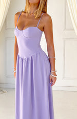 Close-up of a lilac crepe maxi dress showing the bustier bodice and gathered V-shaped waist