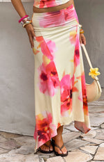 Close-up of the flowy yellow and pink floral print hanky hem maxi skirt