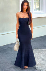 Black strapless bandage maxi dress with a sweetheart neckline, criss-cross bust, and mermaid flare skirt