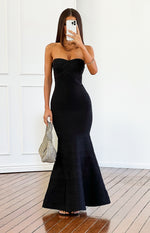 Black bandage strapless maxi dress with criss-cross bust detail and a flared mermaid hem