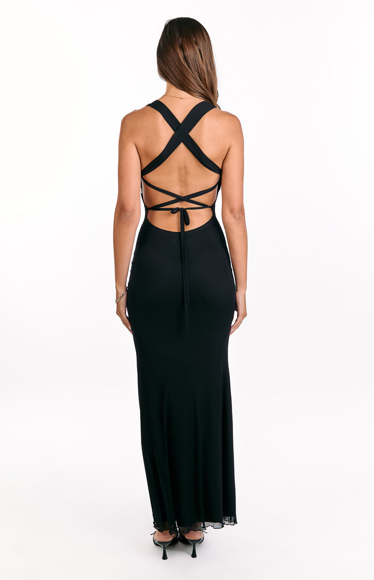 Rear view of a black ribbed knit maxi dress with criss-cross back straps, a low scoop back, and tie closure