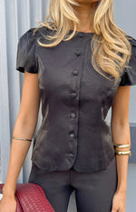 Black organza top with a round neckline, full button-up front, and short puff sleeves
