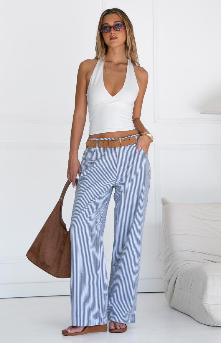 Full length view of navy and white pinstripe mid-rise straight leg jeans