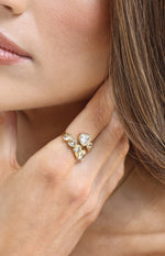 Close-up of the gold wrap ring with multiple heart-shaped diamantes
