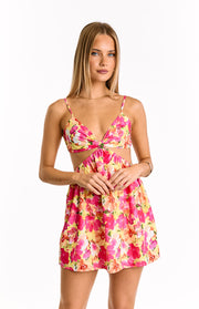 Yellow and pink floral mini dress with a tie-front bust, side cutouts, and a gathered mini skirt