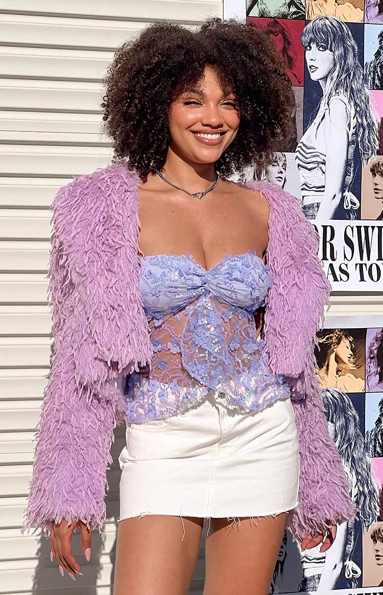 Open front purple fringe jacket with shaggy texture and long sleeves