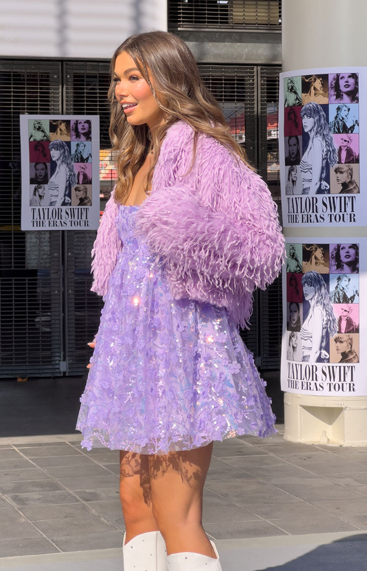 Side view of a light purple shaggy fringe jacket with long sleeves