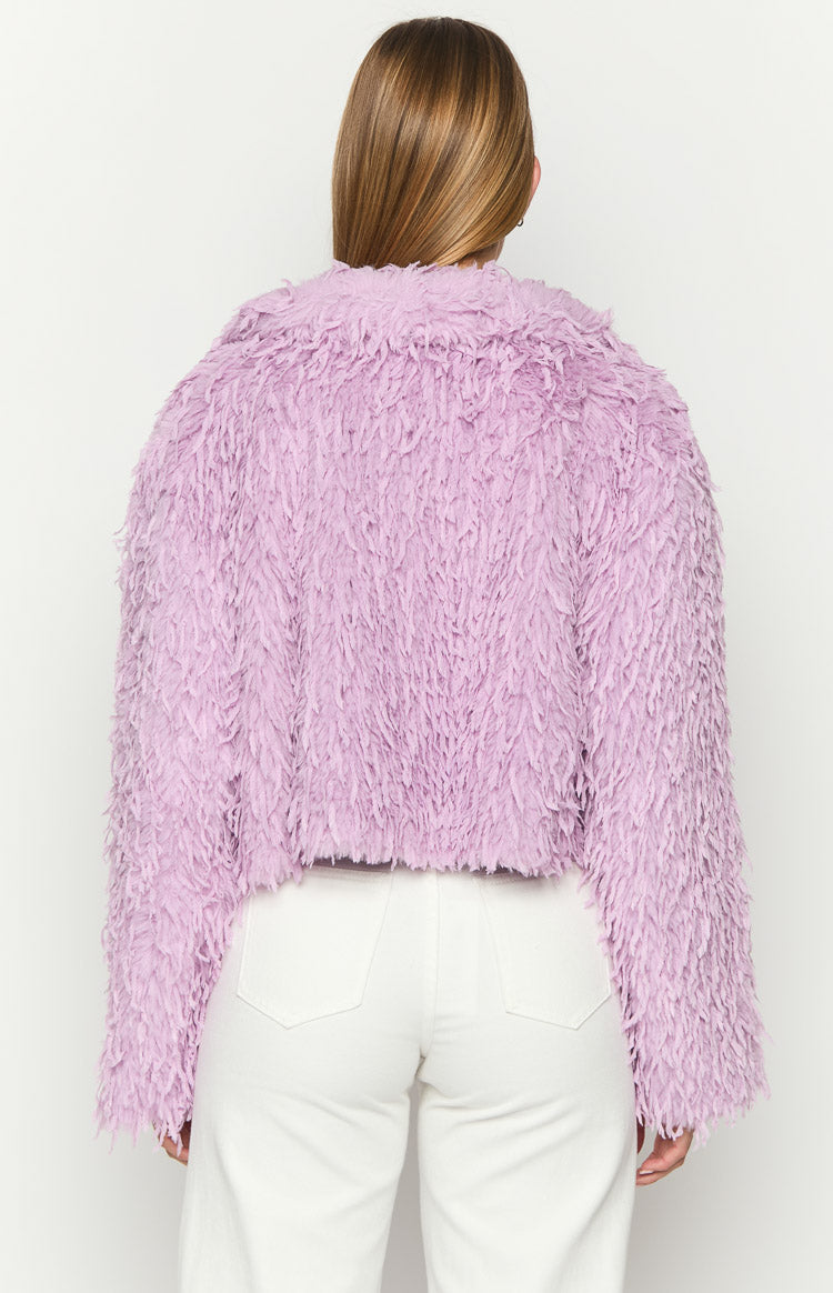 Rear view of a purple cropped jacket with a shaggy fringe texture and long sleeves