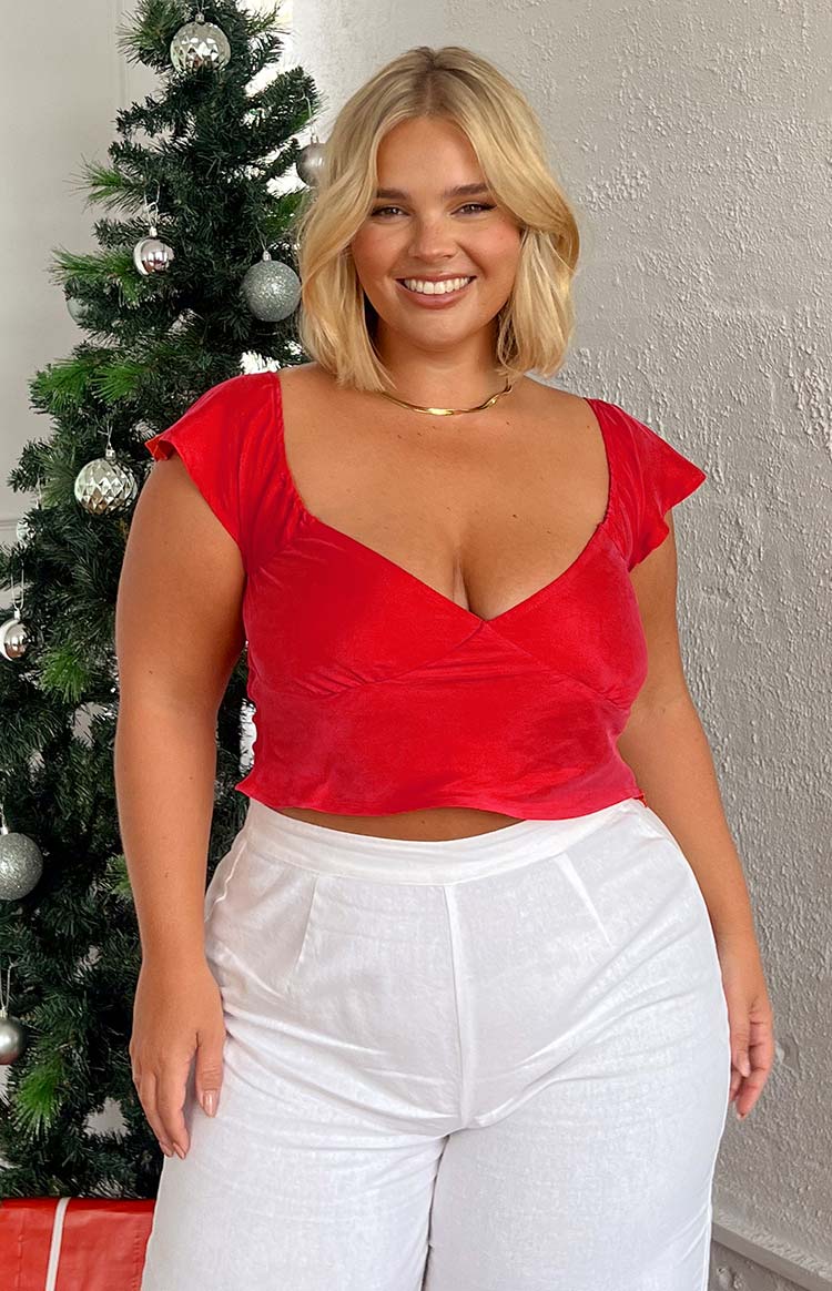 Red velvet cropped top with a wrap V-neckline and short cap sleeves