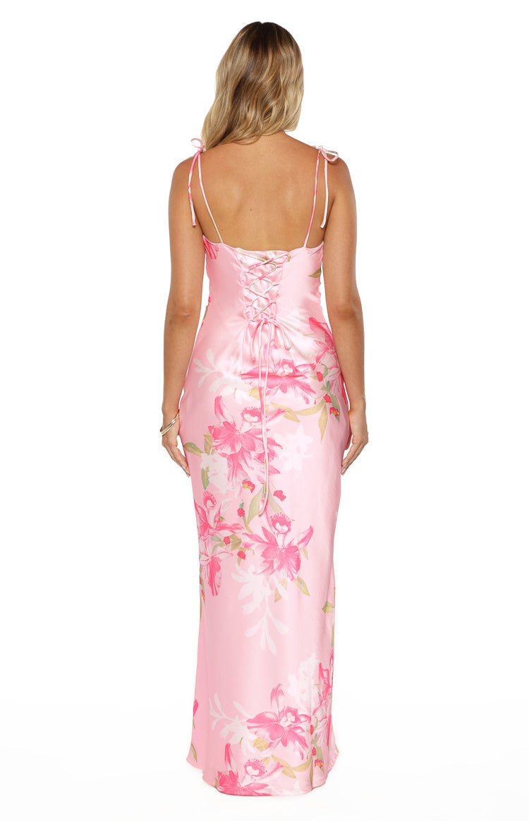Rear view of a pink floral maxi dress with a lace-up corset back and tie spaghetti straps