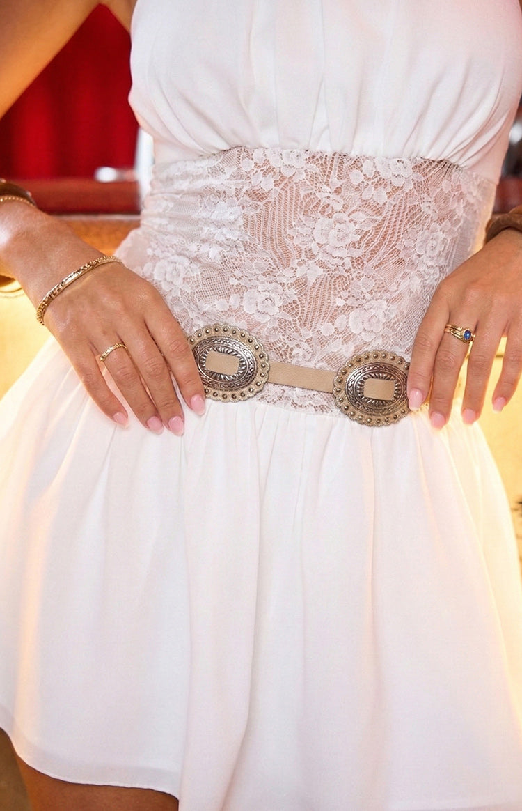 Close-up of the ivory PU thin belt with two large decorative silver oval buckles