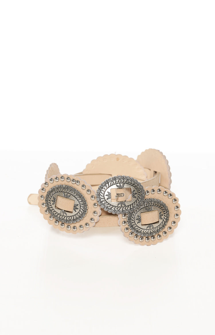 Coiled ivory PU belt with three ornate silver concho buckles, intricate engraving, and scalloped edges