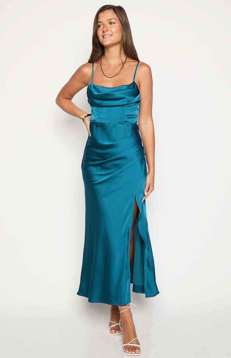 Green satin maxi dress with a cowl neck, thin straps, corset-style bodice, ruched hip detail, and a high thigh split