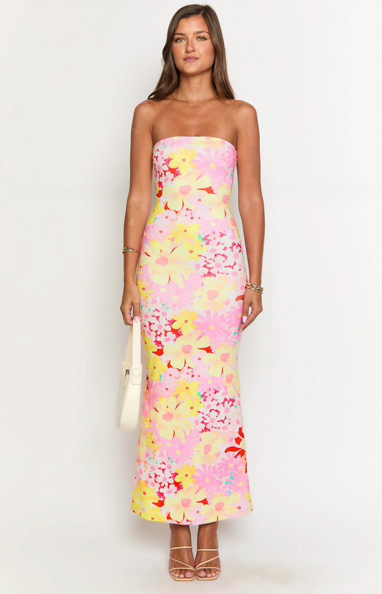 Front view of a pink, yellow, and red floral print strapless maxi dress with a fitted silhouette