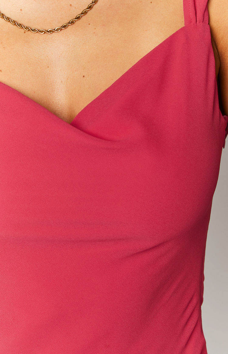 Close-up of the pink chiffon maxi dress showing the sweetheart neckline with wrap detail and thin ruched straps