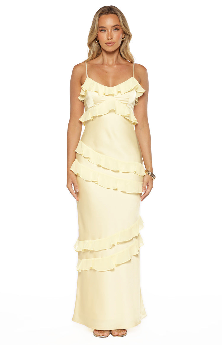 Yellow satin maxi dress with tiered ruffles on the bust and diagonal ruffles down the skirt