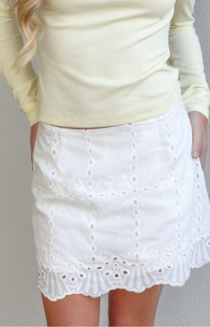 Beginning Boutique Ayla White Broderie Mini Skort white broderie anglaise mini skort with eyelet details and a scalloped hem