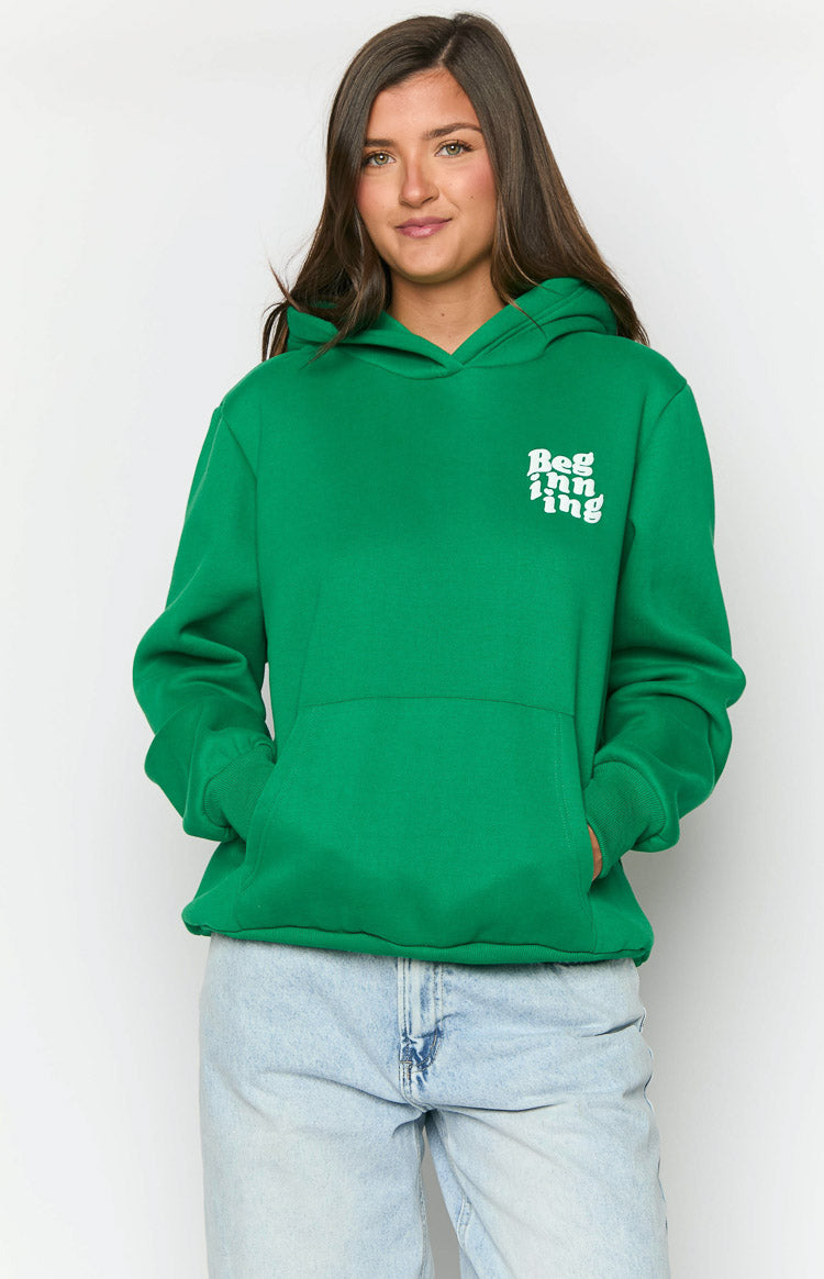 Front view of a green oversized hoodie with a white Beginning logo on the chest and a large kangaroo pocket