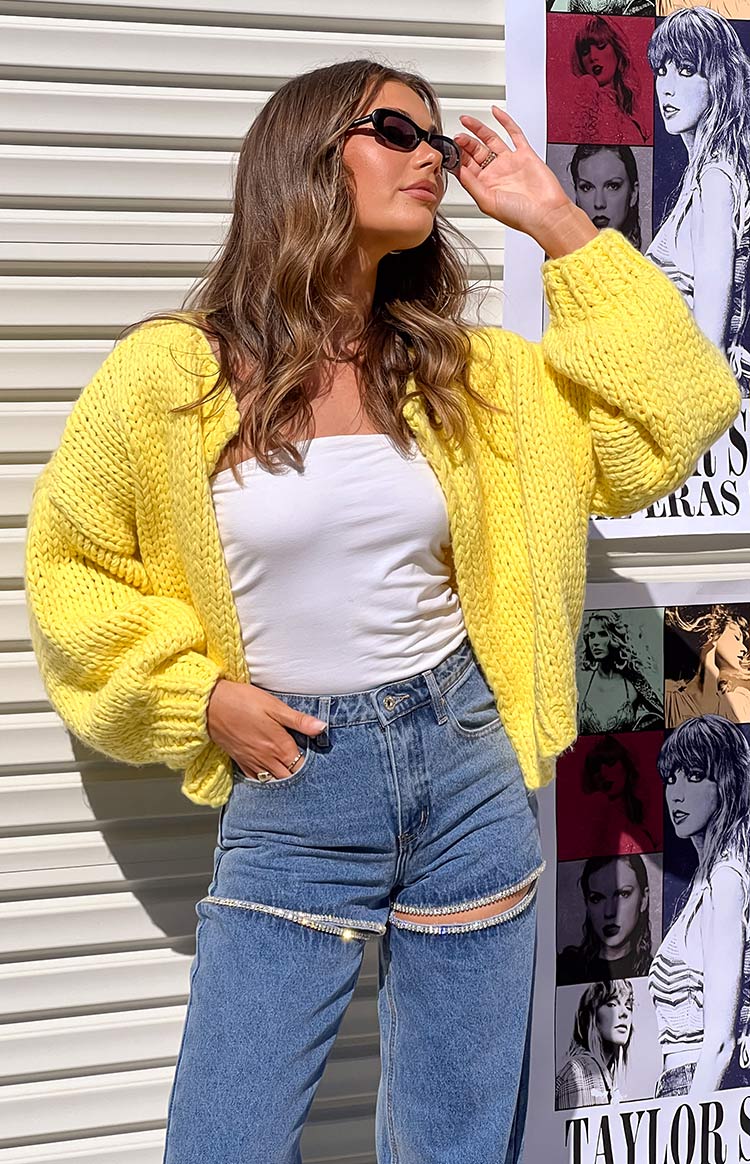 Yellow chunky knit cardigan with voluminous long sleeves and a relaxed fit