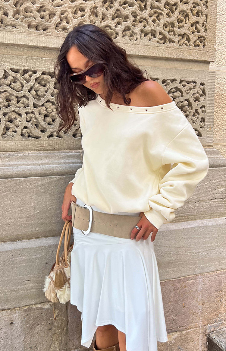 Beginning Boutique Bambi Cream Asymmetric Neckline Eyelet Sweater cream oversized sweater with an asymmetric off-shoulder neckline and eyelet detail