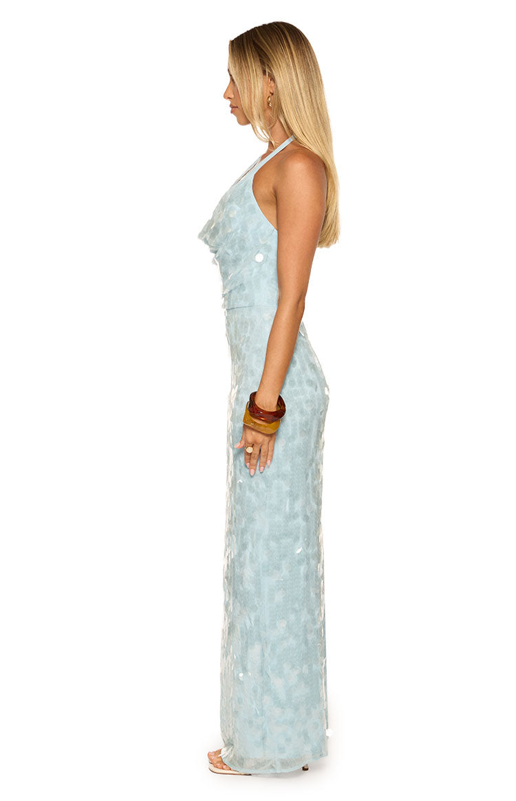 Side view of the light blue sequin cowl maxi dress showing its fitted silhouette